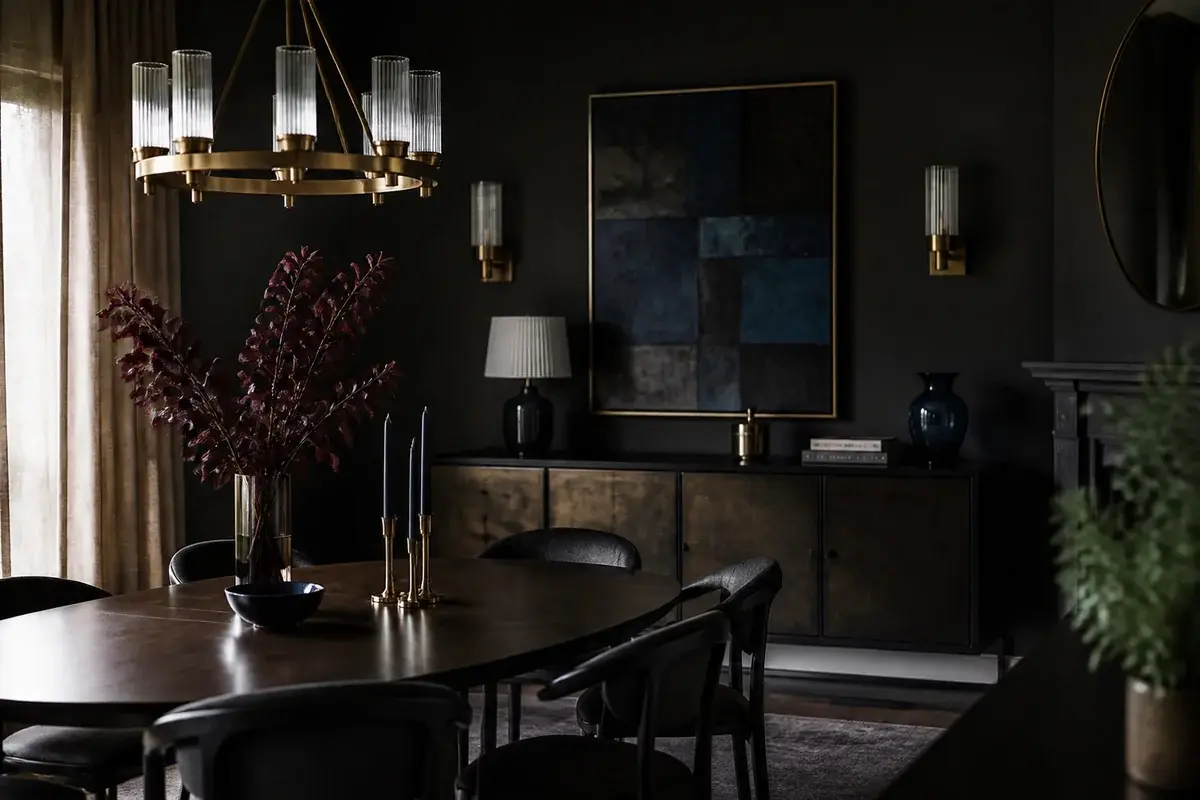 A styled dining room with deep navy blue accents